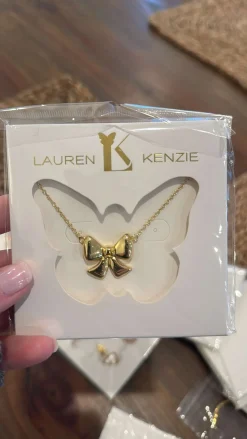 Golden Bow Necklace by Lauren Kenzie