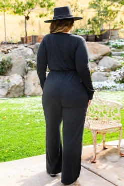 Onward & Upward Faux Wrap Jumpsuit In Black