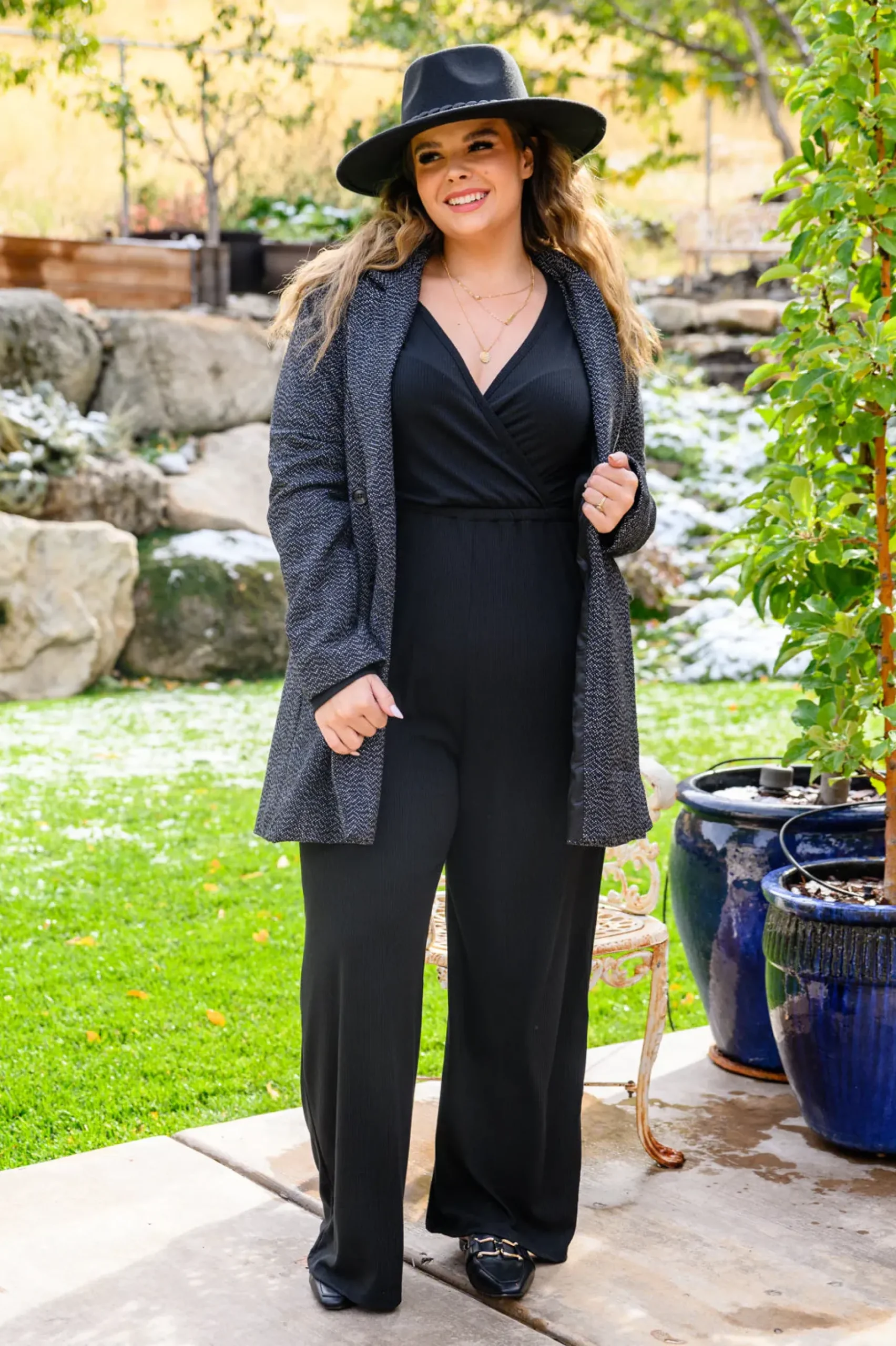 Onward & Upward Faux Wrap Jumpsuit In Black