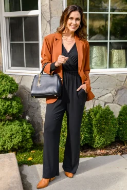 Onward & Upward Faux Wrap Jumpsuit In Black